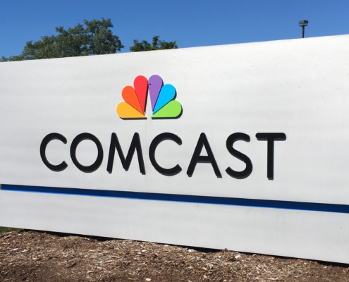 Comcast corporate headquarters logo building signifying Comcast splits into two separate companies