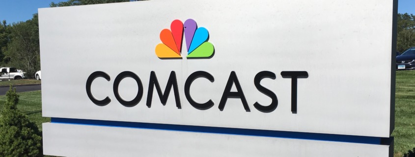 Comcast corporate headquarters logo building signifying Comcast splits into two separate companies